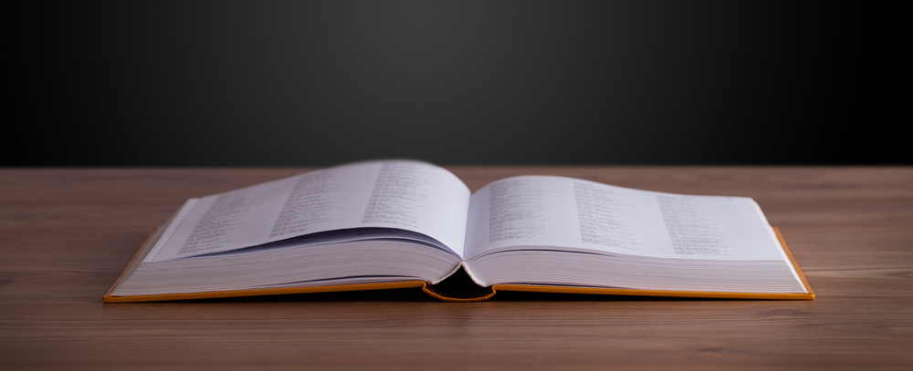 Open book on wooden deck and copy space-s